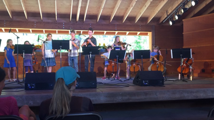 Student string ensemble on an outdoor stage